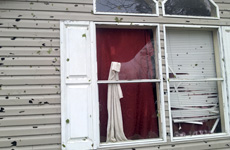 window and siding damaged by hail