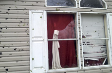 hail-window-damage-mn window and siding damaged by hail