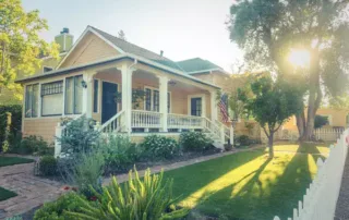 Beautiful view of an US home and it's yellow brand new siding